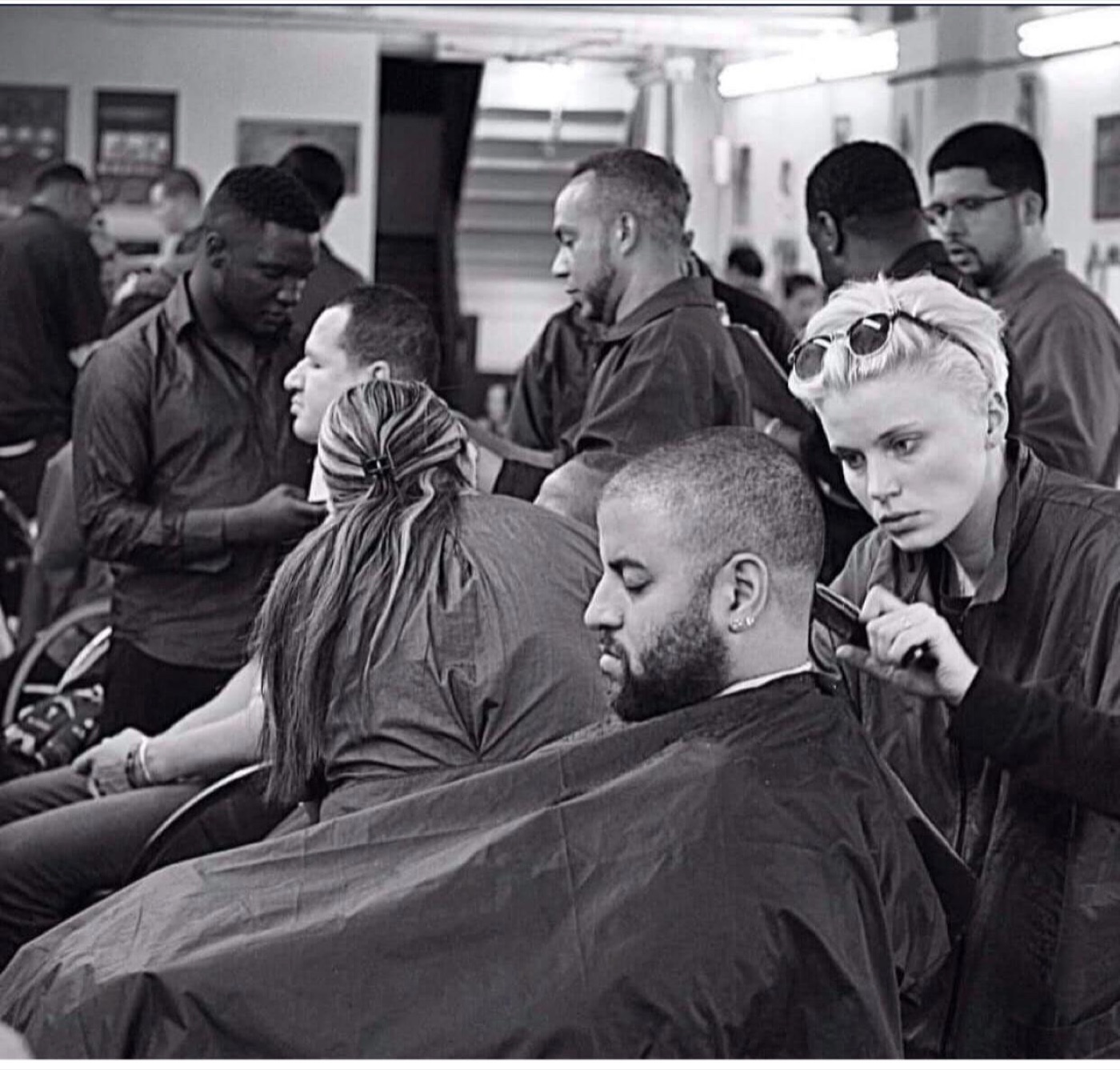Student giving a client a straight-razor shave