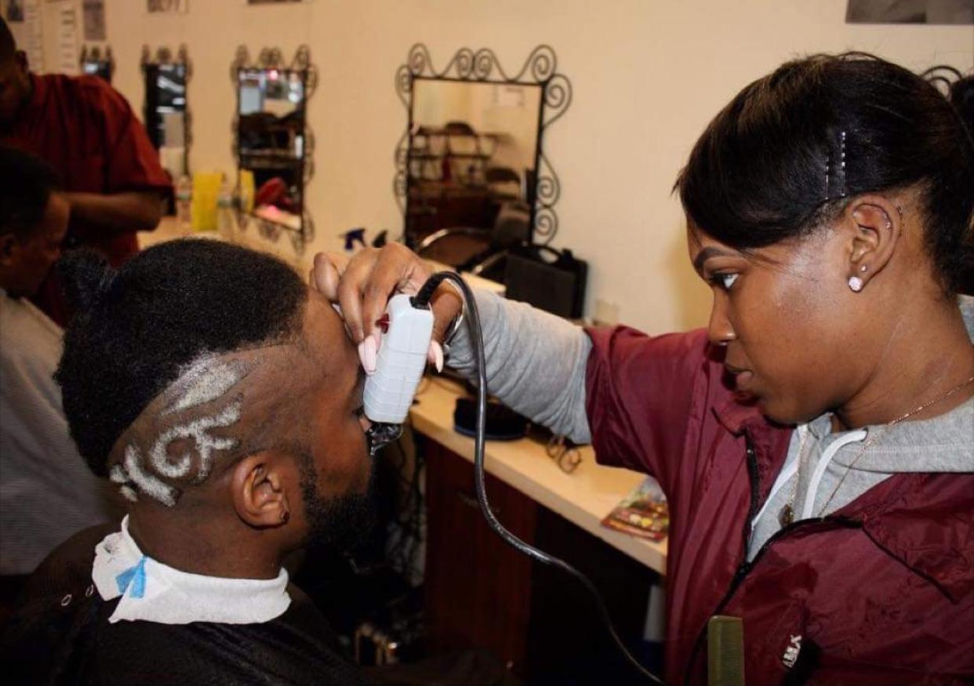 Student clipping client's design fade