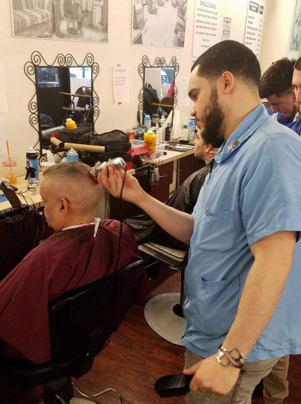 Barber edging client's hairline