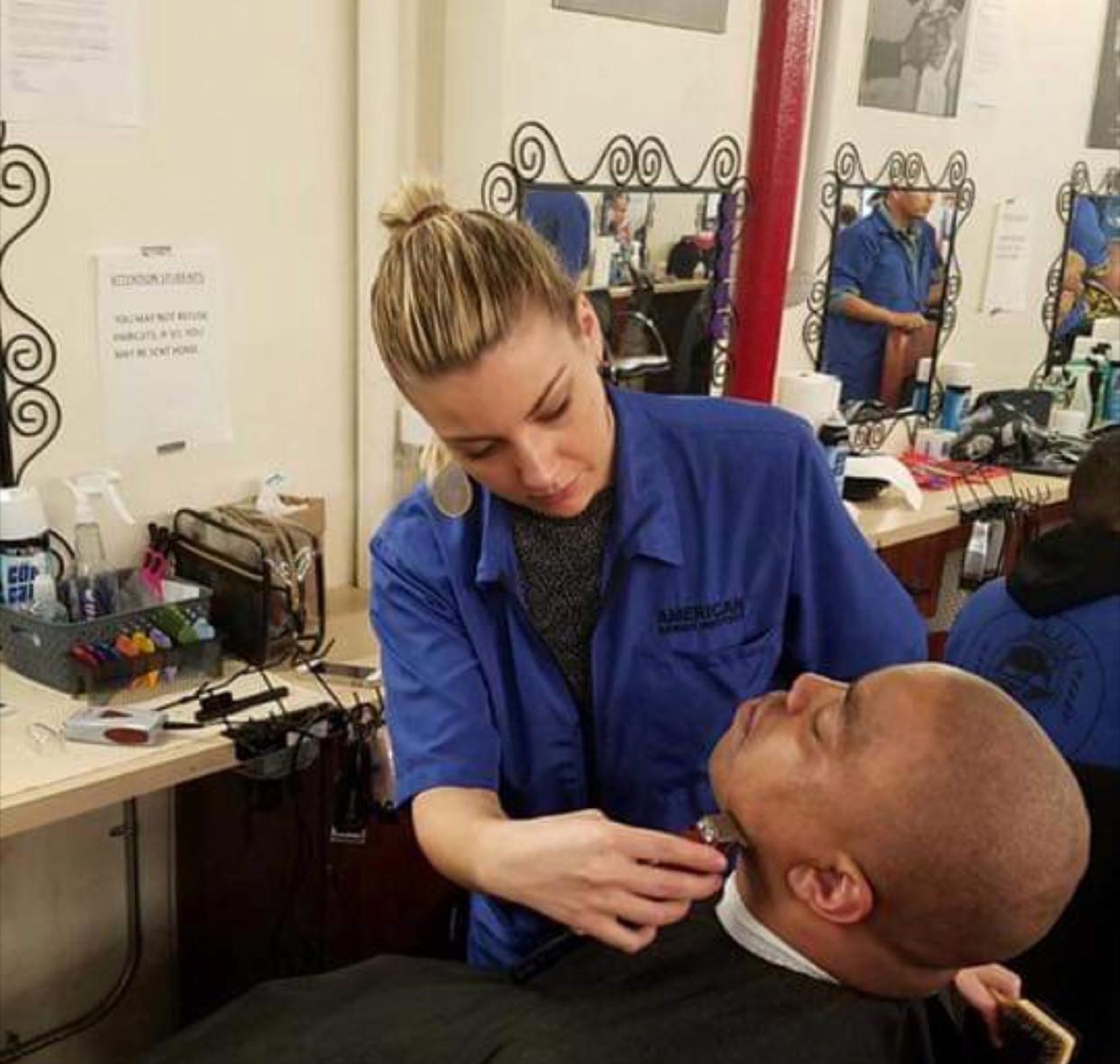 Barber detailing a client's beard
