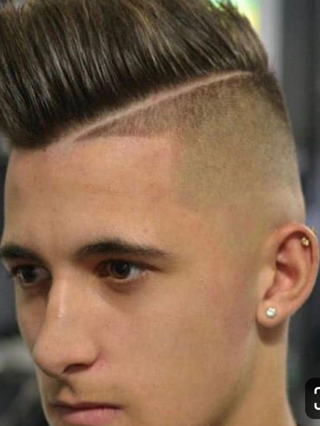 Student barber practicing a skin fade