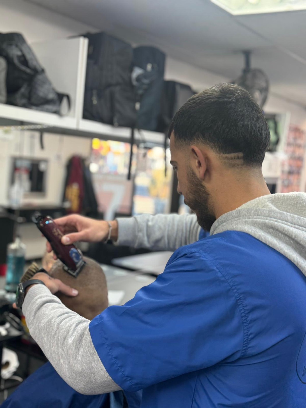 Student in barbershop interior